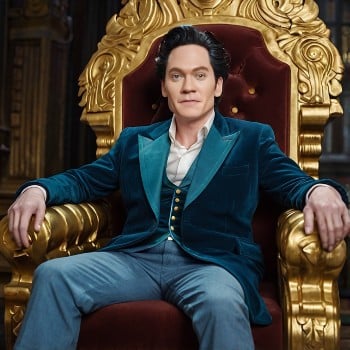 Bryan Johnson sitting in a king chair