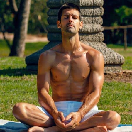 Novak Djokovic meditating in a park